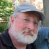 Candid portrait of Patrick Leary wearing a ball cap